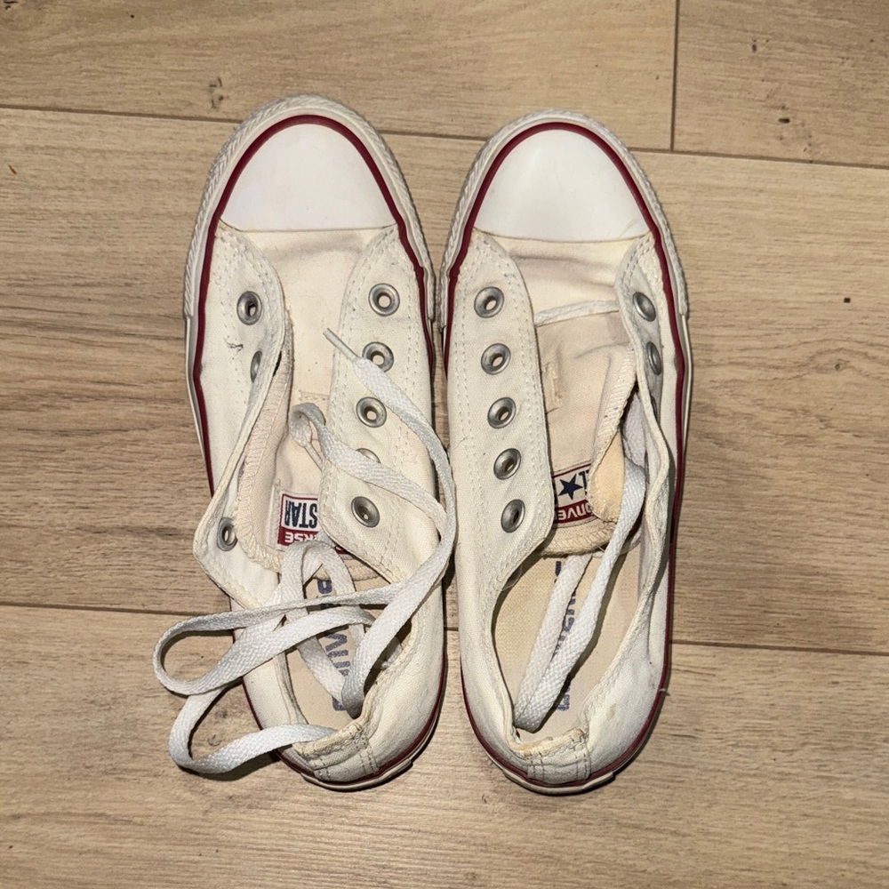 Converse Off-White Canvas Slip-On Sneakers with Red Accents